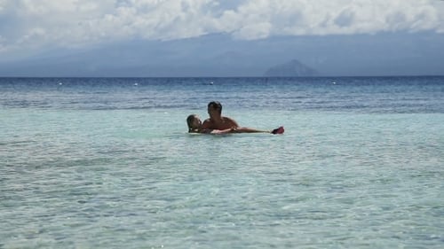 Father and Daughter Playing in the Sea