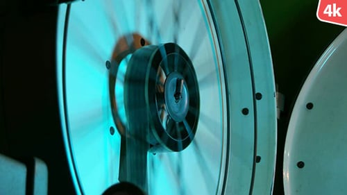 Industrial Machine Part Rotating Under Blue Light