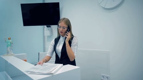 Office Manager Talking On The Phone