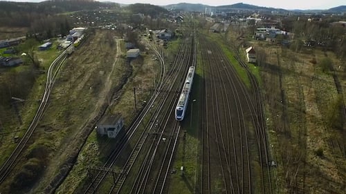 Modern Train Travels Through Extensive Railway System