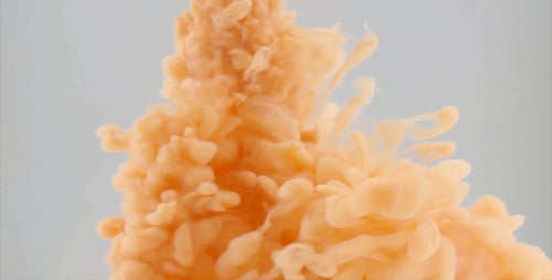 Peach Colored Ink Unfurls and Blooms in Water