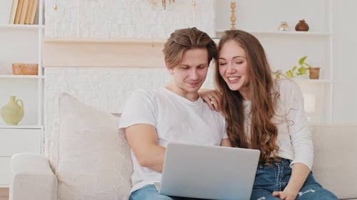 Happy Couple Video Chatting Together at Home