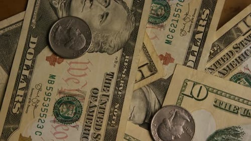 Close Up of US Ten Dollar Bills and Coins