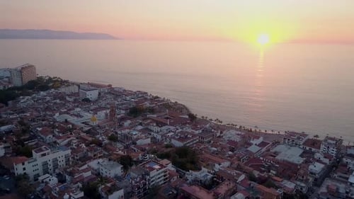 Aerial View of Coastal City at Sunrise