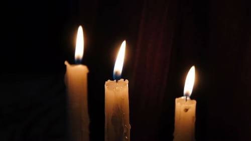 Three Burning Candles in the Darkness