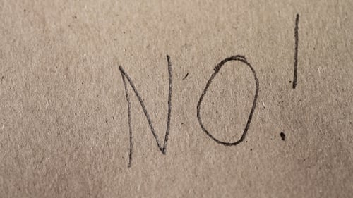Person Writes With a Pencil on Paper 1