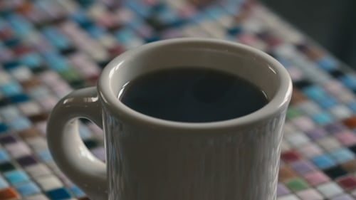 Steaming Coffee in a White Mug Close Up