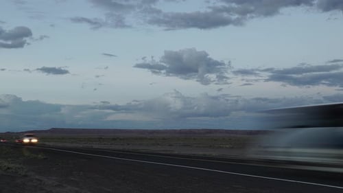 Timelpase Of Cars Driving Along A Desert Road (2 Of 2)