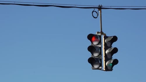 Traffic Light Cycling Through Colors In Daylight