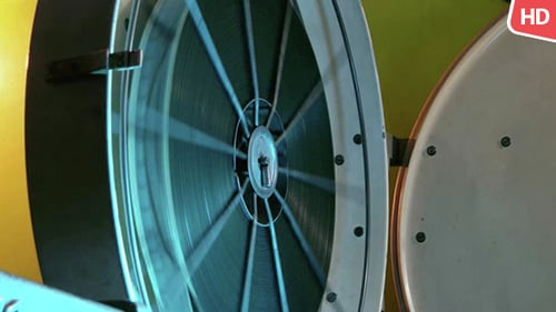 Vintage Film Projector Reel Spinning Rapidly Close Up