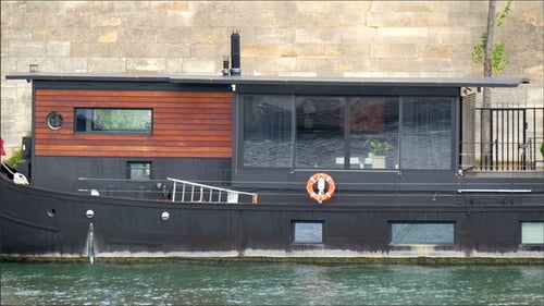 Long Floating Boat on the River in Paris