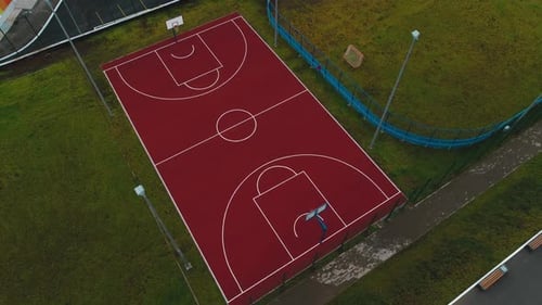 Basketball Ground with New Marking Near Rink on Green Lawn