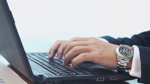 Businessman Typing on Laptop