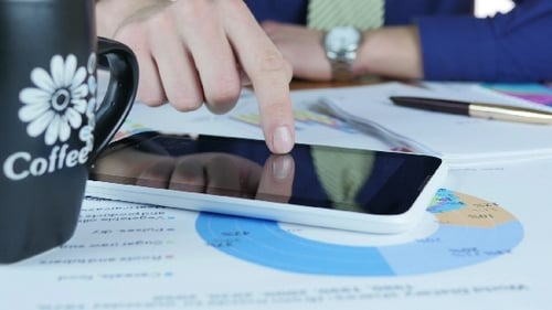 Business Man Using Tablet in Workplace Office