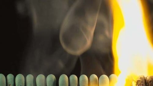 Matches Igniting in Flame with Billowing Smoke