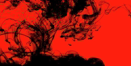 Black Ink Dissolving into Red Abstract Background