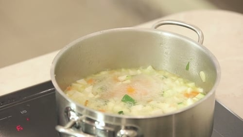 Boiling Pot Of Vegetable Soup On Top Of The Stove