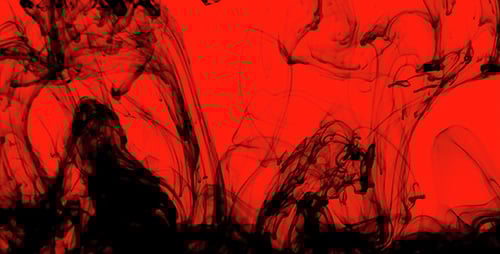 Black Ink Billowing on a Red Background