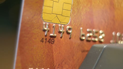 Extreme Close Up of Credit Card on Table