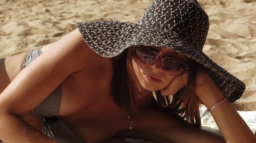 Sexy Woman In Bikini Reading Book At The Sand