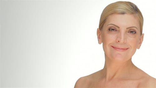 Woman Smiling in Close-up on White Background