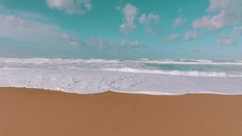 Ocean Waves Incoming On Sand Beach