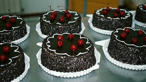 Chocolate Cake With Cherries In a Candy Store