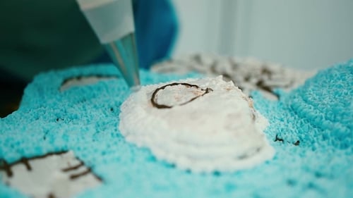 Delicate Frosting Work on Celebration Cake