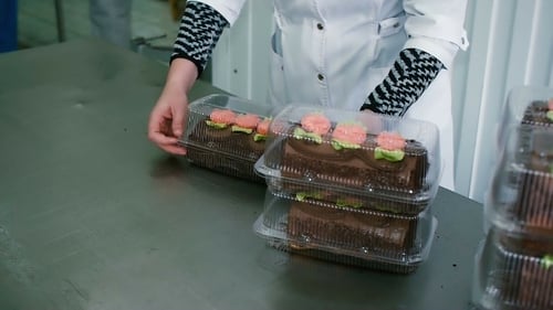 Cake Preparation and Packaging in a Bakery
