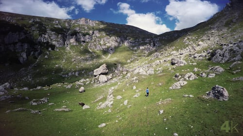 Man Running in the Mountain Valley