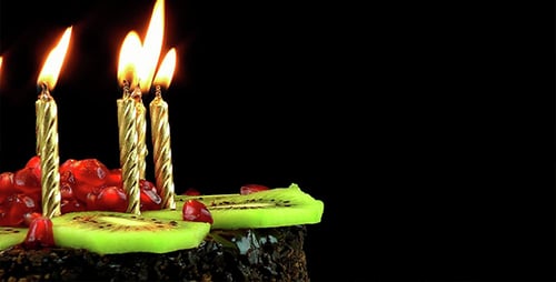 Birthday Cake with Burning Candles, Kiwi and Pomegranate