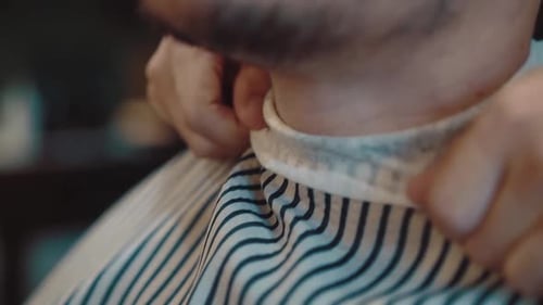 Young Handsome Man is Prepared to Decorate His Beard and Hairstyle in a Barber Shop Closeup Slow