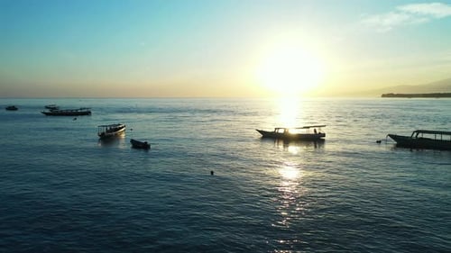 Wide birds eye abstract shot of a paradise sunny white sand beach and aqua blue water background in