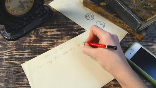 Writing a Letter at a Wooden Desk