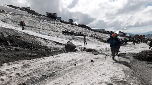 A team of climbers ascending an icy slope on Mt. Everest