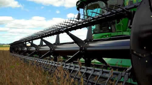 Tractor Ready to Harvest Crops in Farm Field