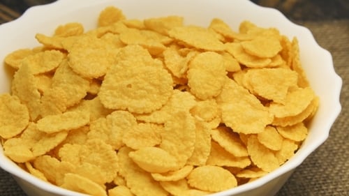 Bowl of Golden Corn Flakes Cereal Close-Up