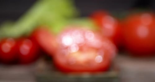Slices of Red Tomato on Wood Table