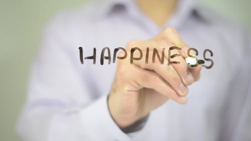 Hand Writes Happiness with Pen on Glass Surface