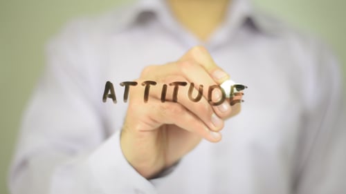 Hand Writes the Word Attitude With Marker