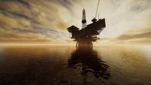 Offshore Jack Up Rig mitten im Meer bei Sonnenuntergang