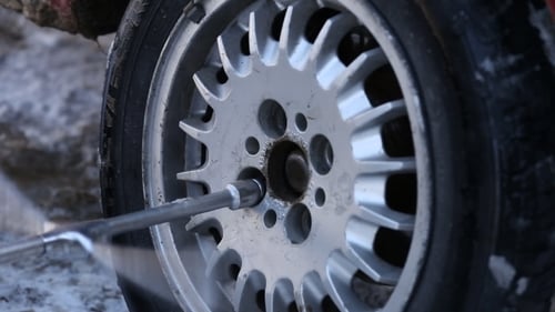 Worker Untwists Wheel