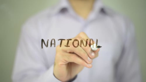 Writing the Word 'National' on Clear Surface