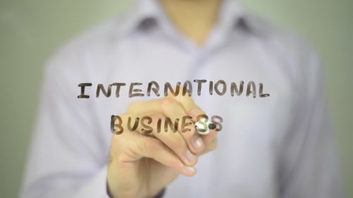 Writing International Business on Clear Surface
