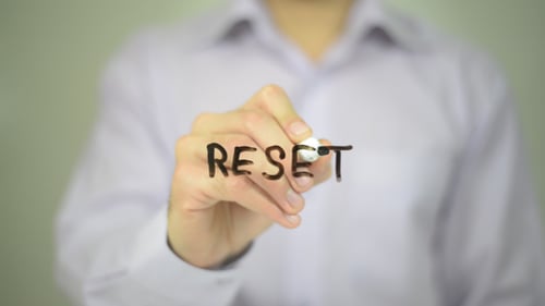 Writing Word Reset on Clear Surface with Marker