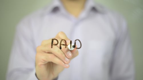 Writing Paid with Marker Close Up