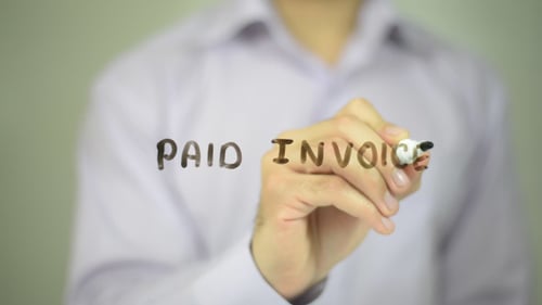 Writing Paid Invoice on Glass