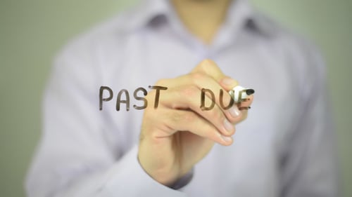 Man Writes 'Past Due' with Marker