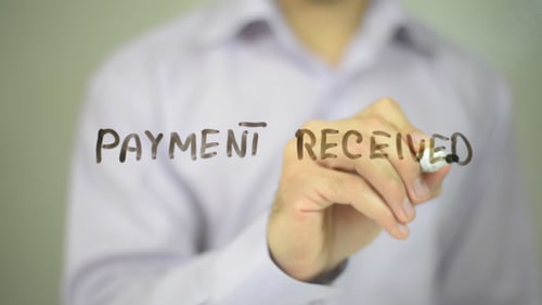 Writing Payment Received Message on Clear Surface