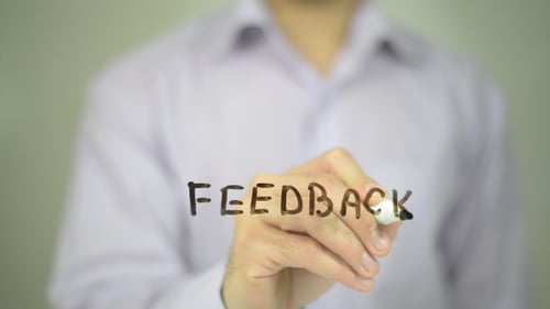 Writing the Word Feedback on a Transparent Surface